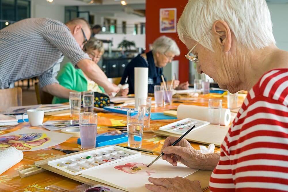 Painting activities inside the communities for seniors