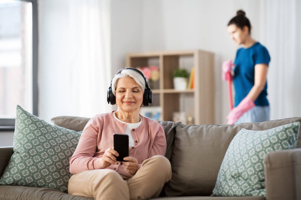 senior woman happily listening to music