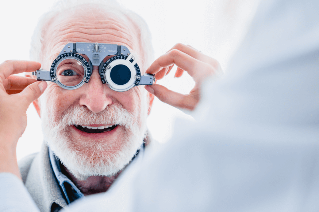 a senior man having his eyes checked by a doctor