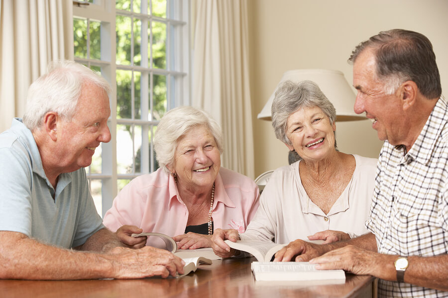 a group of senior happily reading books