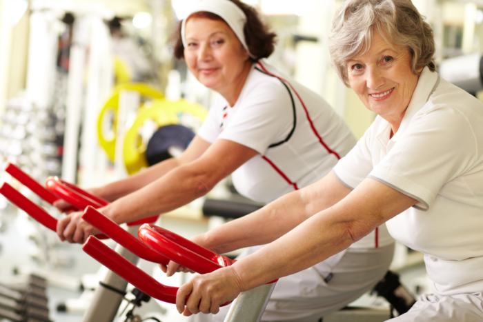 two senior women happily doing their exercise in MD Senior Living