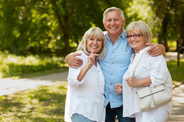 Smiling seniors spending their retirement inside luxury senior living