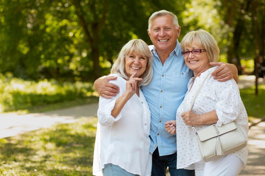 Smiling seniors spending their retirement inside luxury senior living