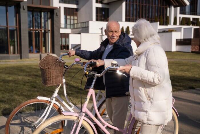 senior people with bicycles during activities inside active retirement communities