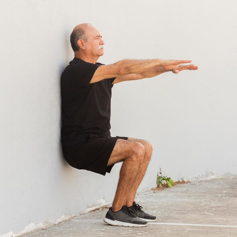 Senior Doing Standing Leg Exercises