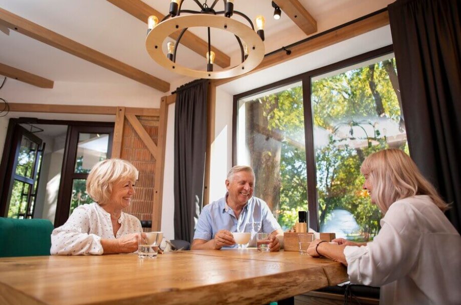 Seniors chatting enjoying their stay in luxury senior living