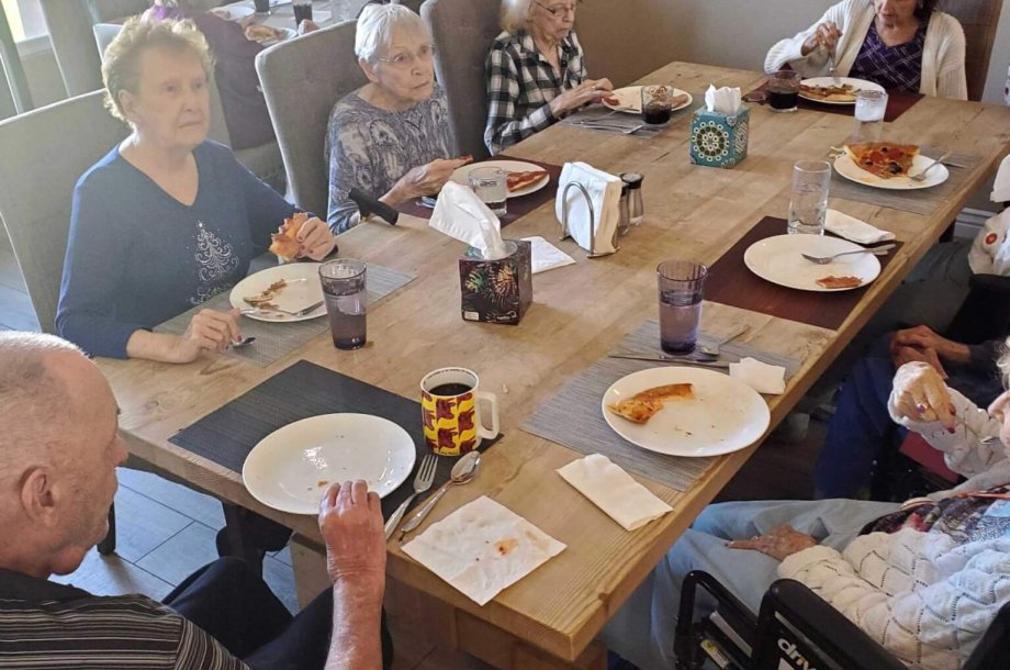 A group of seniors eating together at a table